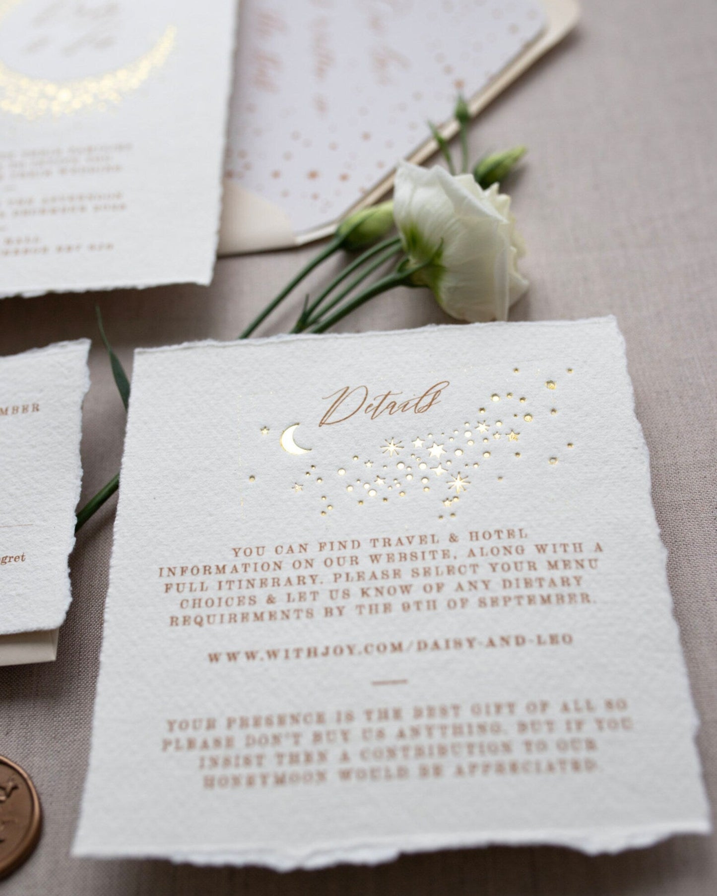 Celestial themed wedding details card. A truly magical scatter of little stars is hot foiled in gold on onto tactile handmade paper with a torn romantic edge. FancyFolk Design