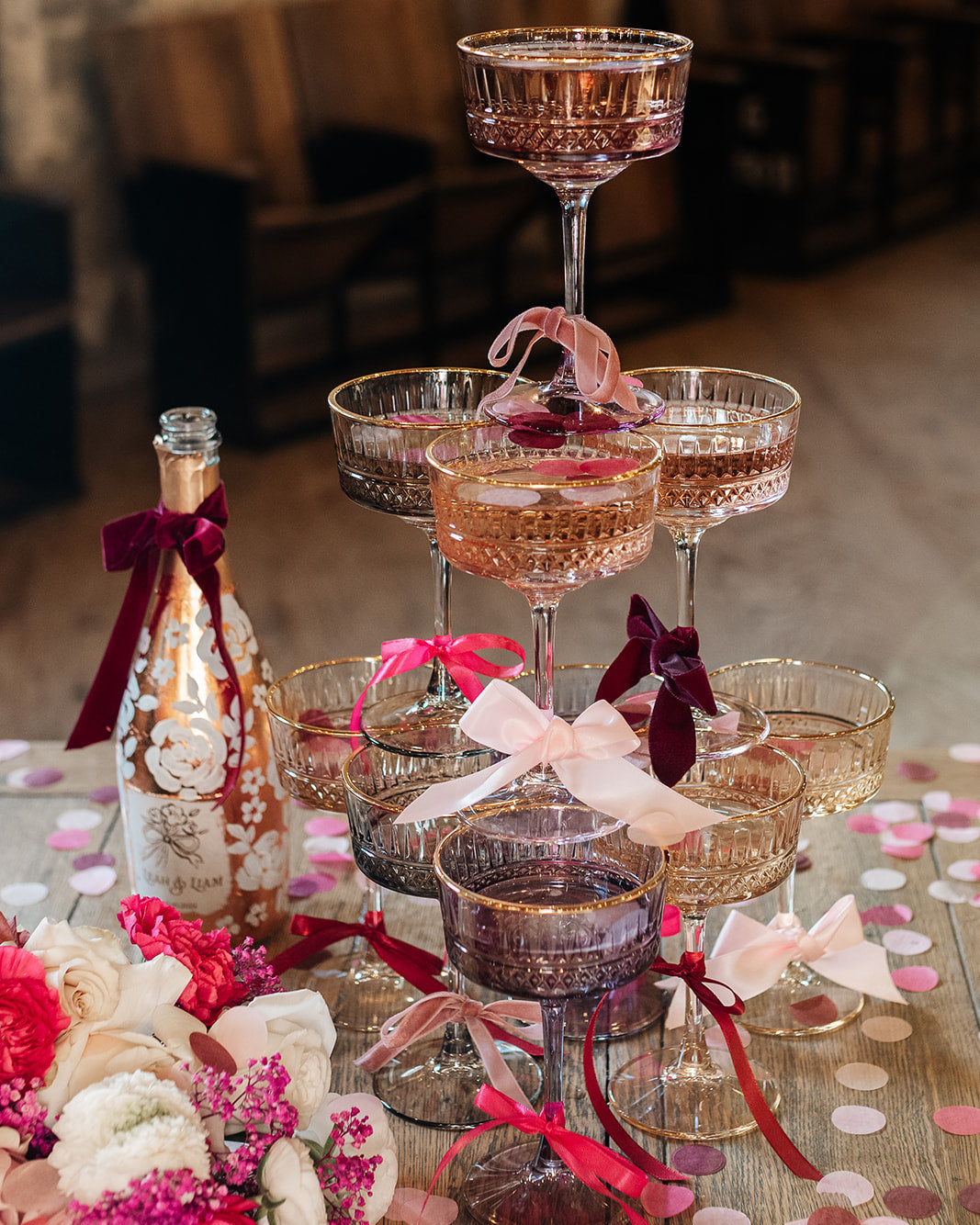 Hand painted wedding Champagne Bottle. Lux Copper leaf base with white painted roses all around the bottle. Personalise label with couples names and wedding date. Perfect for a Champagne Tower moment. By Fancy Folk Design