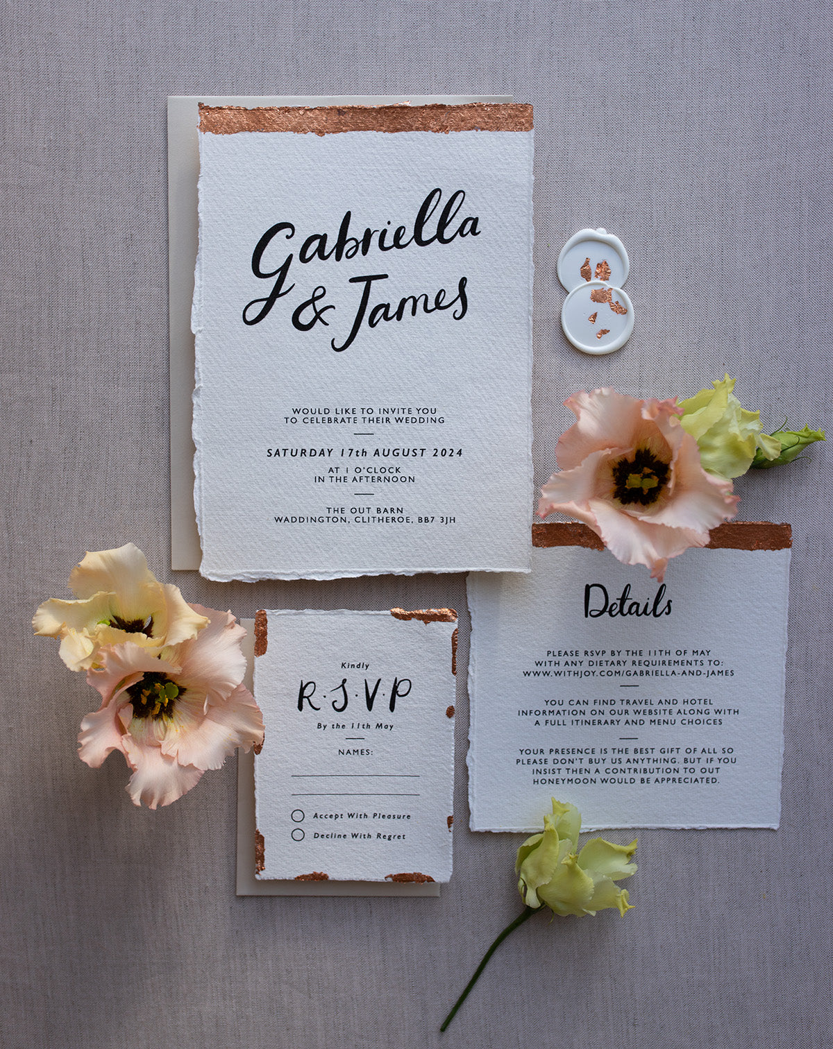Modern Calligraphy Wedding Invitation, Details Card and RSVP with neutral almond coloured envelopes. Our wedding stationery features a beautiful hand lettered calligraphy names design printed on textured handmade Indian paper with hand torn edges for a soft romantic feel. Each piece is lovingly hand finished with copper leaf for a luxury feel. Styled with white and copper leaf wax seals and peachy florals. Fancy Folk