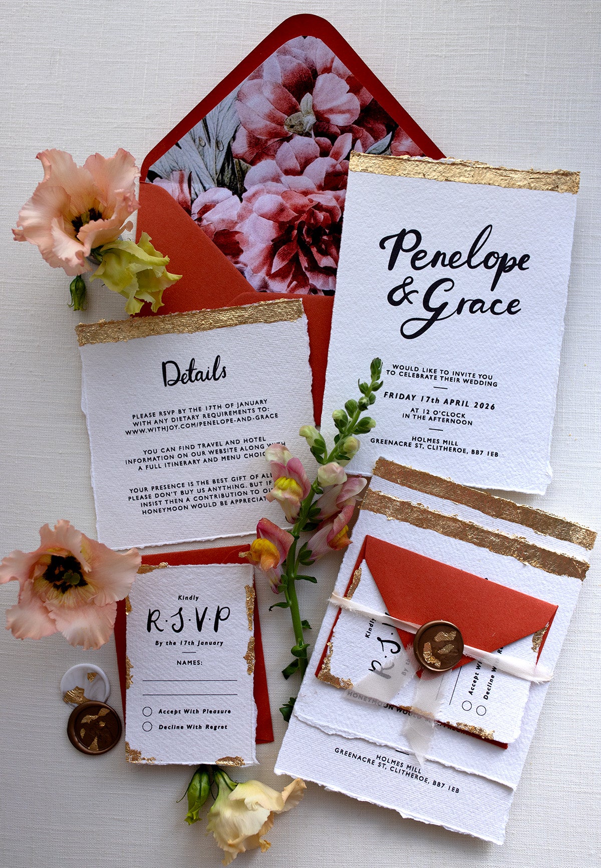 Modern Calligraphy Wedding Suite with terracotta coloured envelopes and floral envelope liners. Our wedding stationery features a beautiful hand lettered calligraphy names design printed on textured handmade Indian paper with hand torn edges for a soft romantic feel. Each piece is lovingly hand finished with gold leaf for a luxury feel. Styled with white and gold leaf wax seals and peachy florals. Fancy Folk