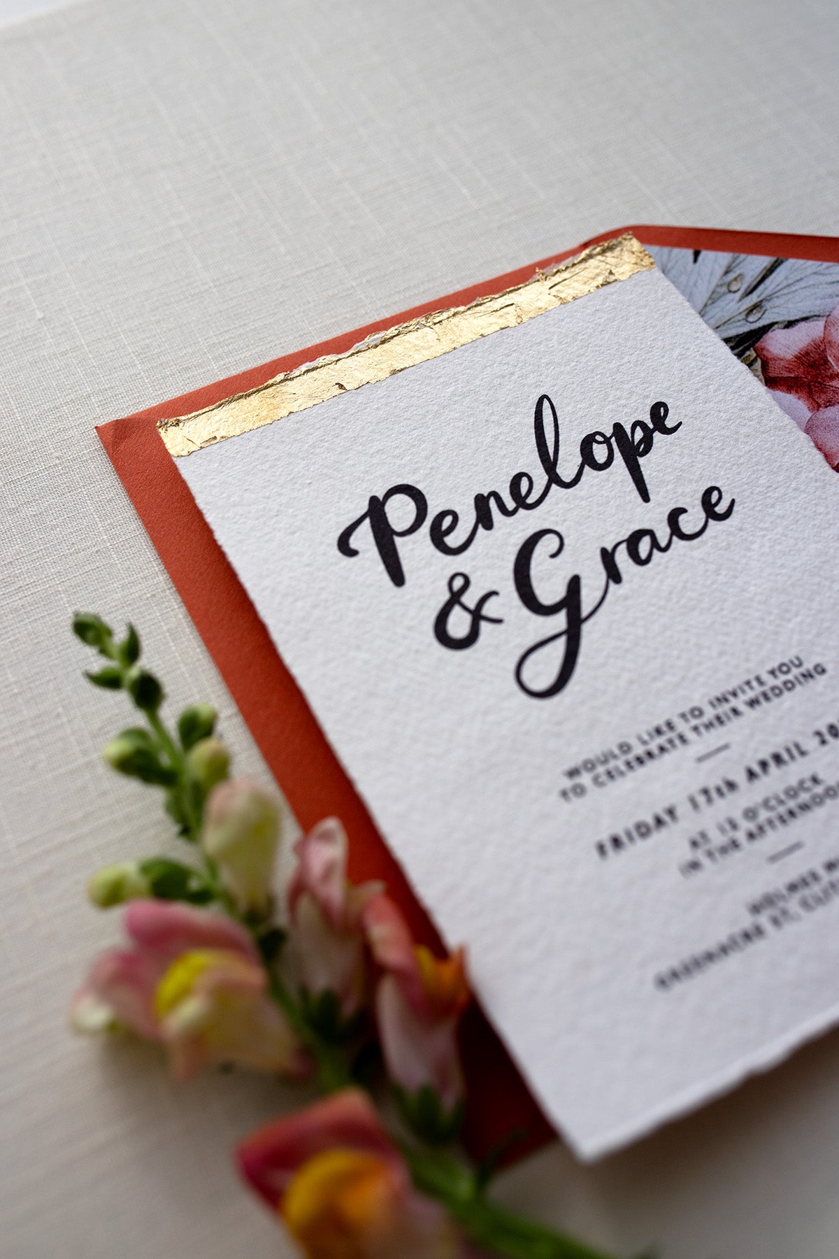 Super shiny gold leaf finish on our Modern Calligraphy Wedding Invitations. Styled with terracotta envelopes. Fancy Folk