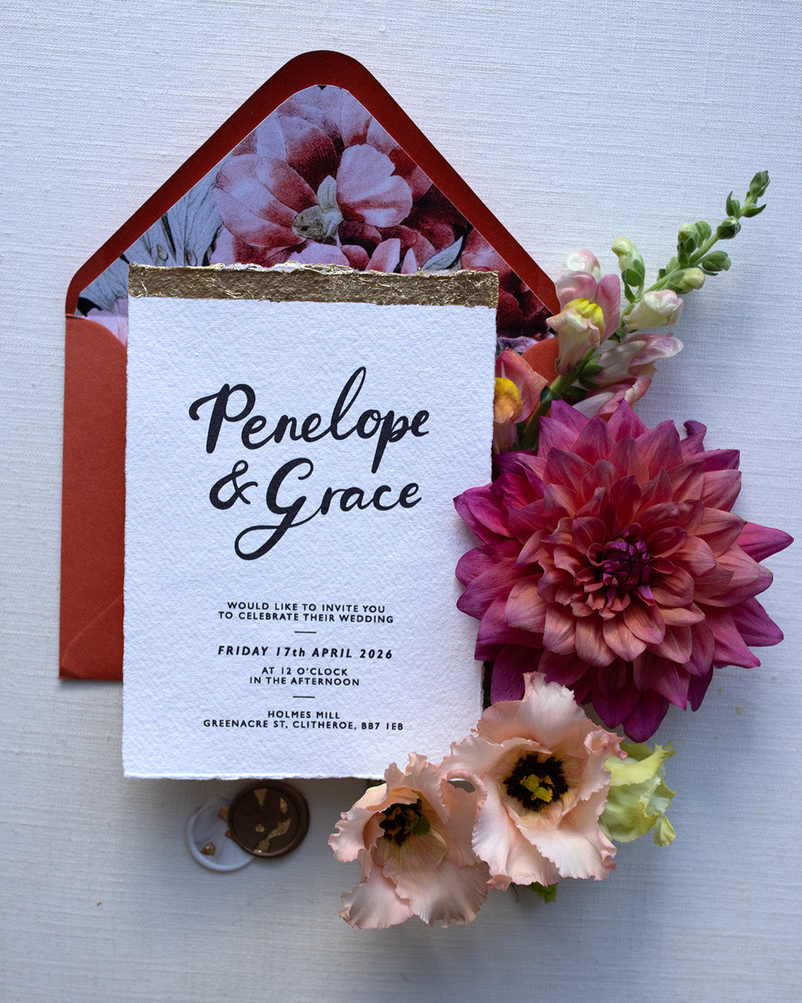 Super shiny gold leaf finish on our Modern Calligraphy Wedding Invitations. Styled with terracotta envelopes and floral envelope liners. Handmade on Indian paper with hand torn romantic edges. Fancy Folk
