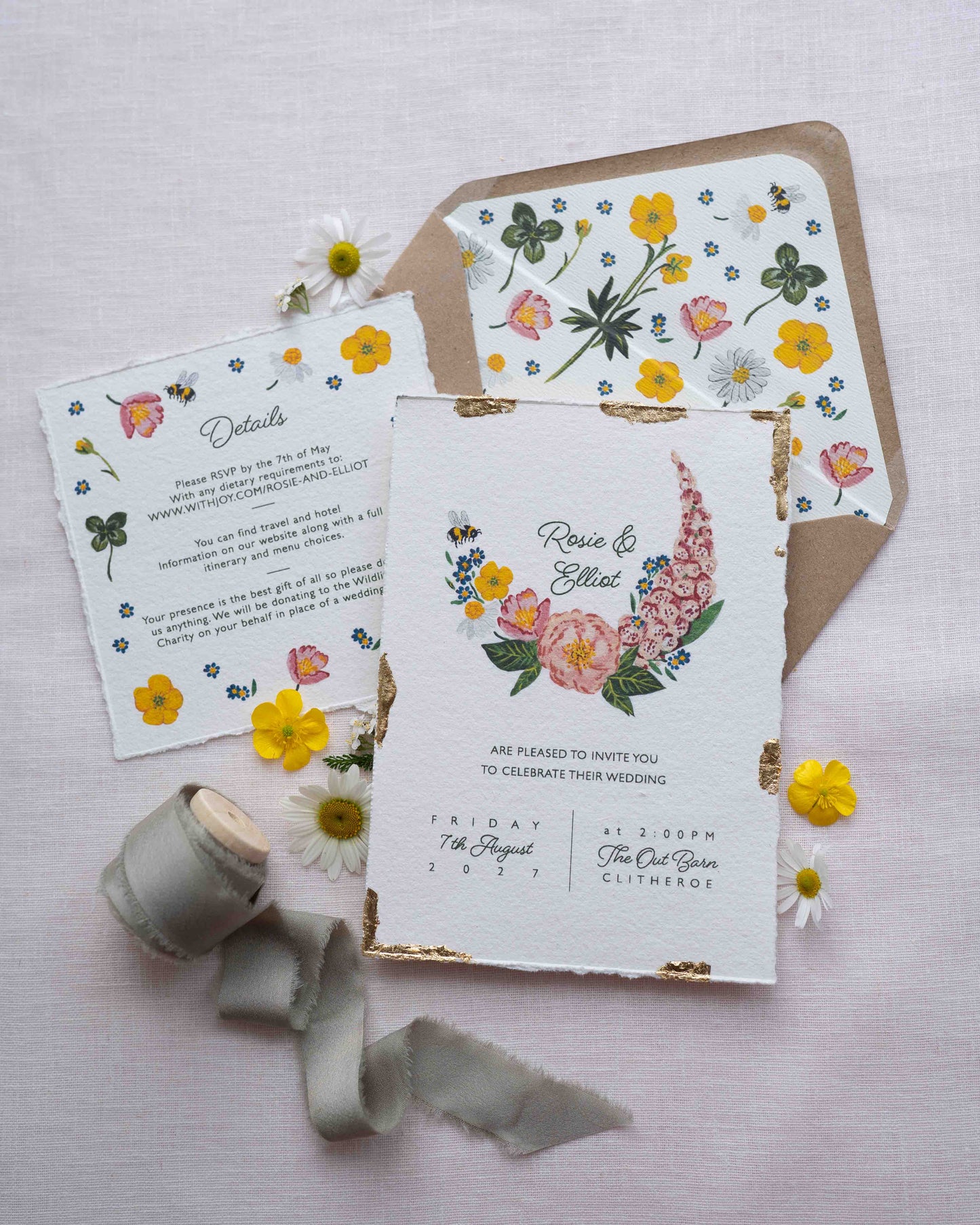 Watercolour hand painted florals of meadow flowers and a little bee make up a posy. Couples names are nestled in the floral. Printed on handmade Indian cotton paper with gold leaf accent. Styled with floral envelope liners and silk ribbon. Rustic Kraft envelopes and fresh flowers.