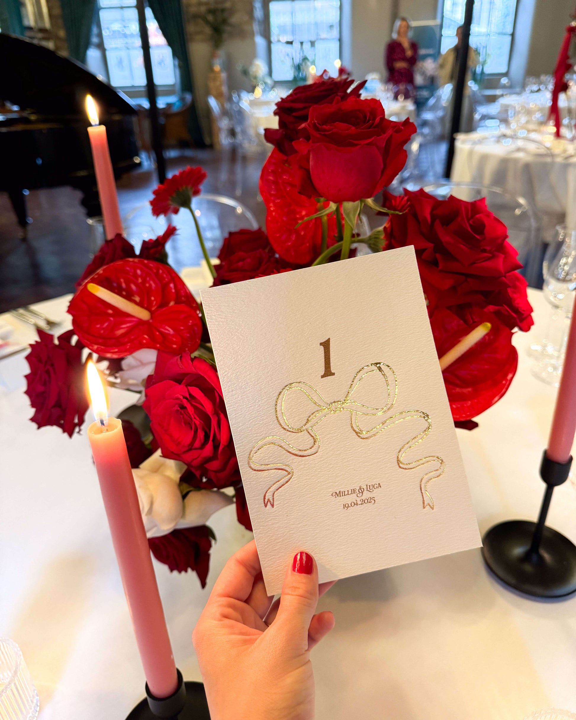 Gold Foil Bow design Wedding Table Numbers with printed couples names and wedding date. Designed by Fancy Folk Wedding Sationery