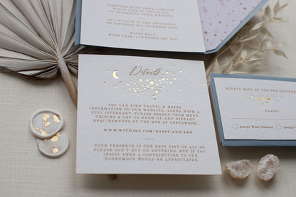 Celestial themed wedding details card. A truly magical design made up of lots of little stars is hot foiled in gold on to thick textured card. Styled with silk ribbon and dusty blue coloured envelopes and wax seals. FancyFolk Design