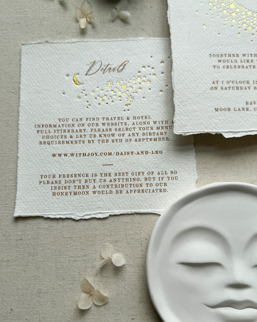 Celestial themed wedding details card. A truly magical scatter of little stars is hot foiled in gold on onto tactile handmade paper with a torn romantic edge. FancyFolk Design