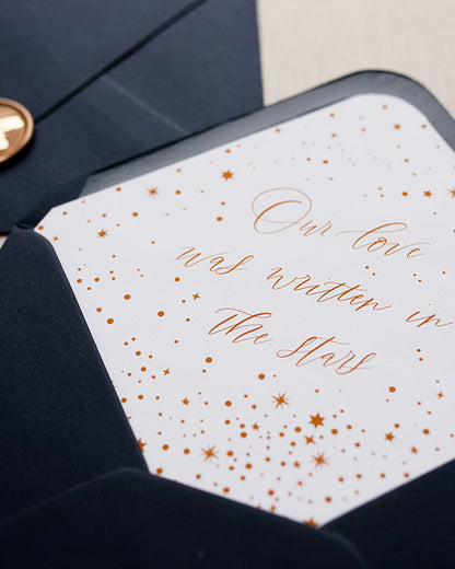 Celestial envelope liner inside a navy blue envelope. Elevate your wedding stainer with this luxury night stars design, wording ready "Our love was written on the stars". Fancy Folk Design