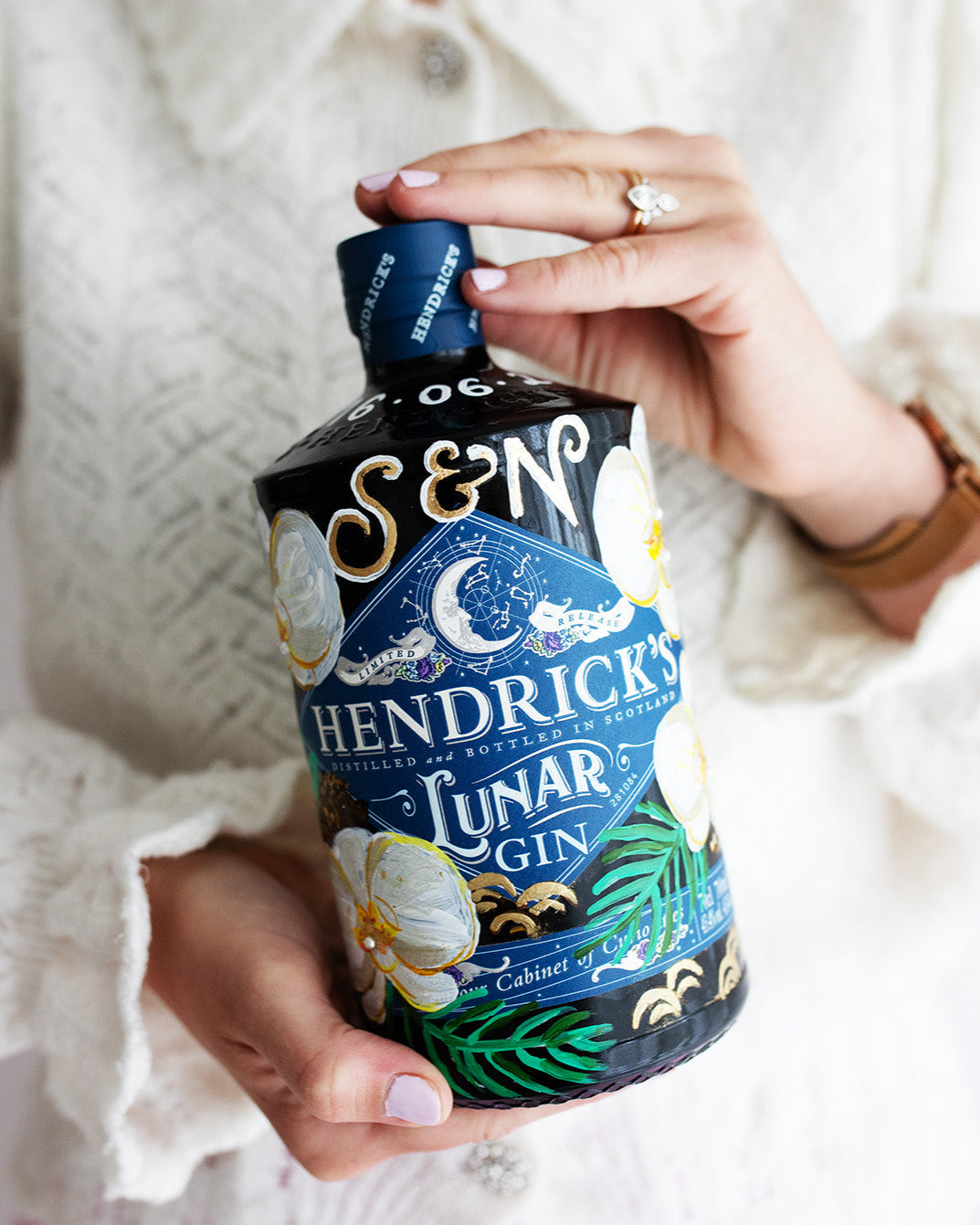Wedding Gift. Hand painted bottle with orchid flowers. Embellished with gold leaf and pearls.Personalised with wedding date and couples initials. Fancy Folk
