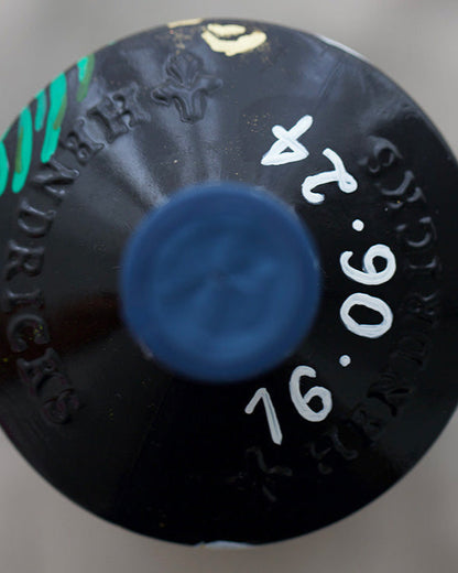 Close up of hand painted wedding date in white. On a beautifully personalised occasion bottle, wedding gift.