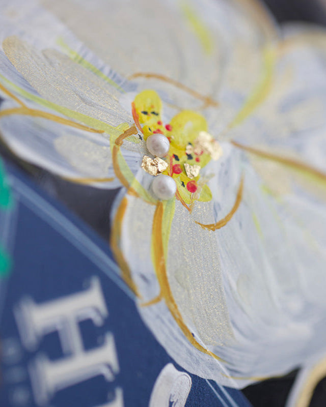 close up of painted orchid with gold  leaf and pearl accents. Handpainted Wedding Bottle Gift.