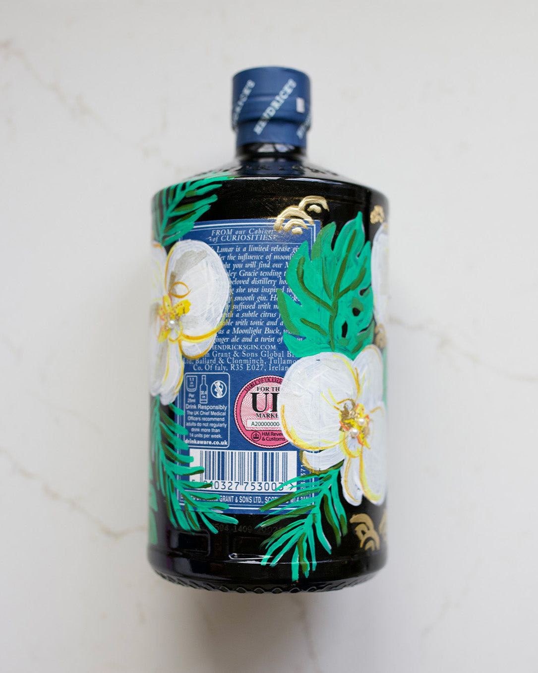 Back of the bottle. Hand painted bottle with orchid flowers Wedding Gift. Embellished with gold leaf and pearls. Personalised with wedding date and couples initials. 