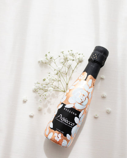 Mini bottles of Prosecco hand painted with a white roses design on a metallic copper leaf base. The perfect luxury bridesmaid proposal gift. Paired with a pink roses panted design available in a separate listing. Fancy Folk Design