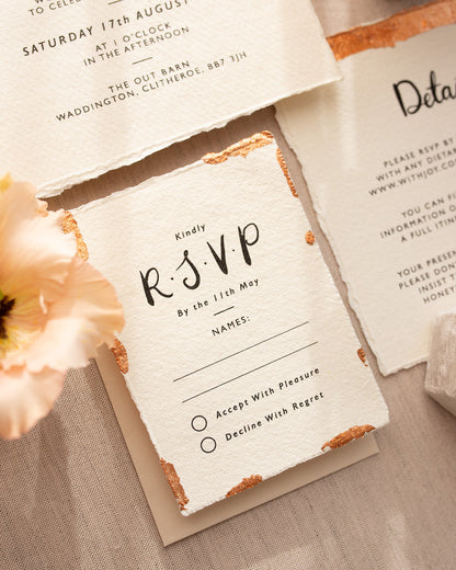 Modern Calligraphy Wedding RSVP with neutral almond coloured envelopes. Our wedding stationery is printed on textured handmade Indian paper with hand torn edges for a soft romantic feel. Each piece is lovingly hand finished with copper leaf for a luxury feel. Fancy Folk