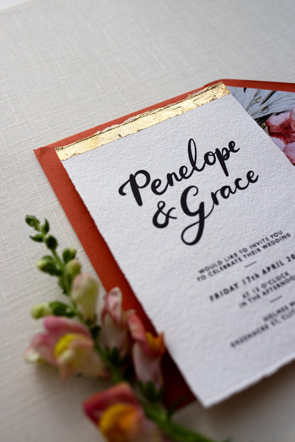Super shiny gold leaf finish on our Modern Calligraphy Wedding Invitations. Styled with terracotta envelopes. Fancy Folk