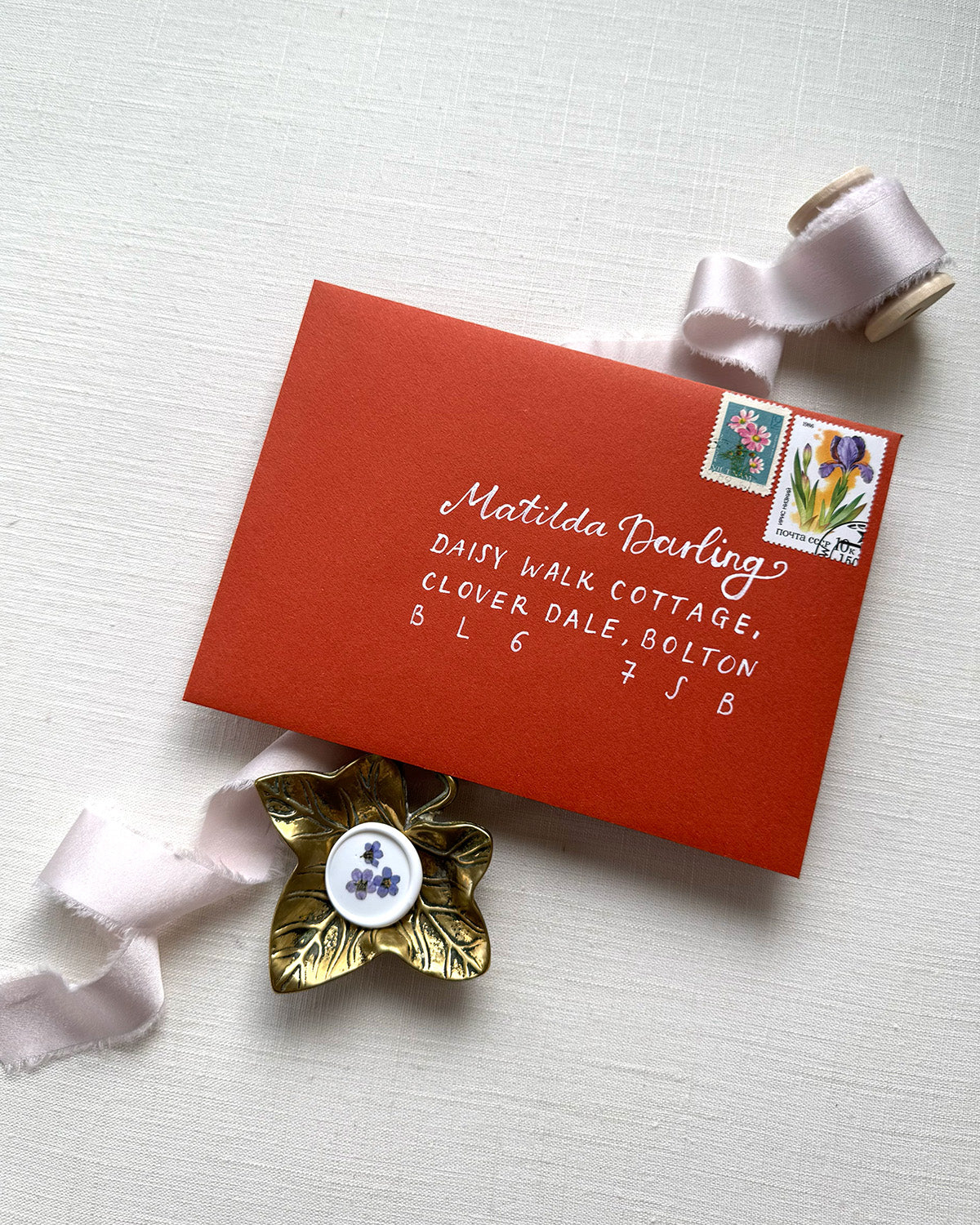 Wedding envelope calligraphy names and address in a white ink. Written on a   terracotta envelope. Fancy Folk