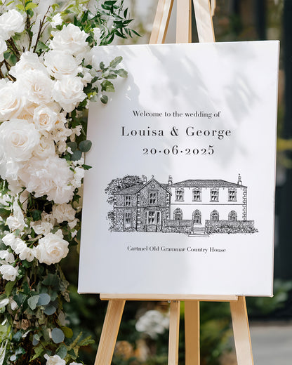 wedding venue illustrated in a line drawing style printed on a large welcome board. Placed on an easel with chic white florals. Fancy Folk