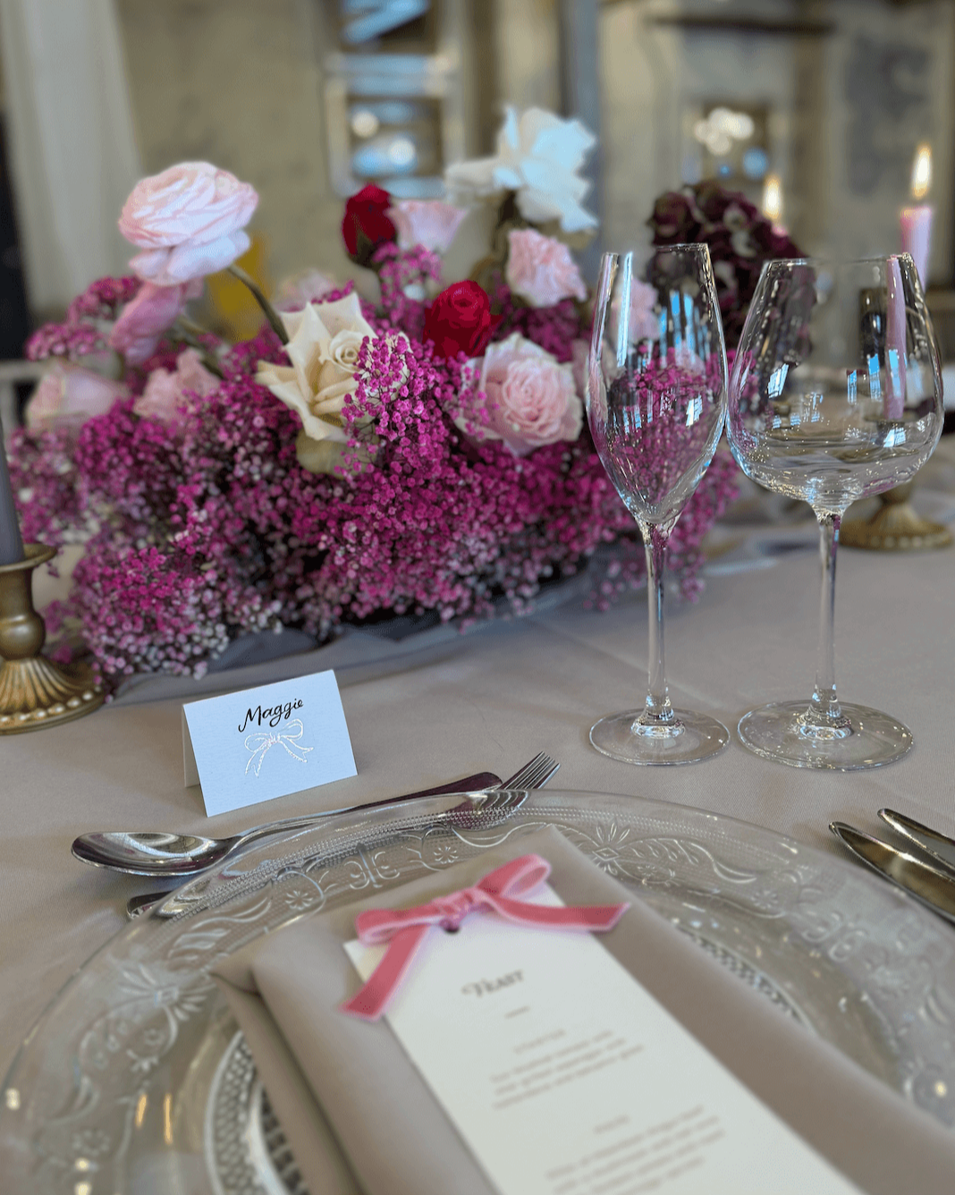 Foiled bow design place card for your wedding table with hand calligraphy bride text. Hot pink floral table centres. Velvet bow menus. Fancy Folk wedding stationery