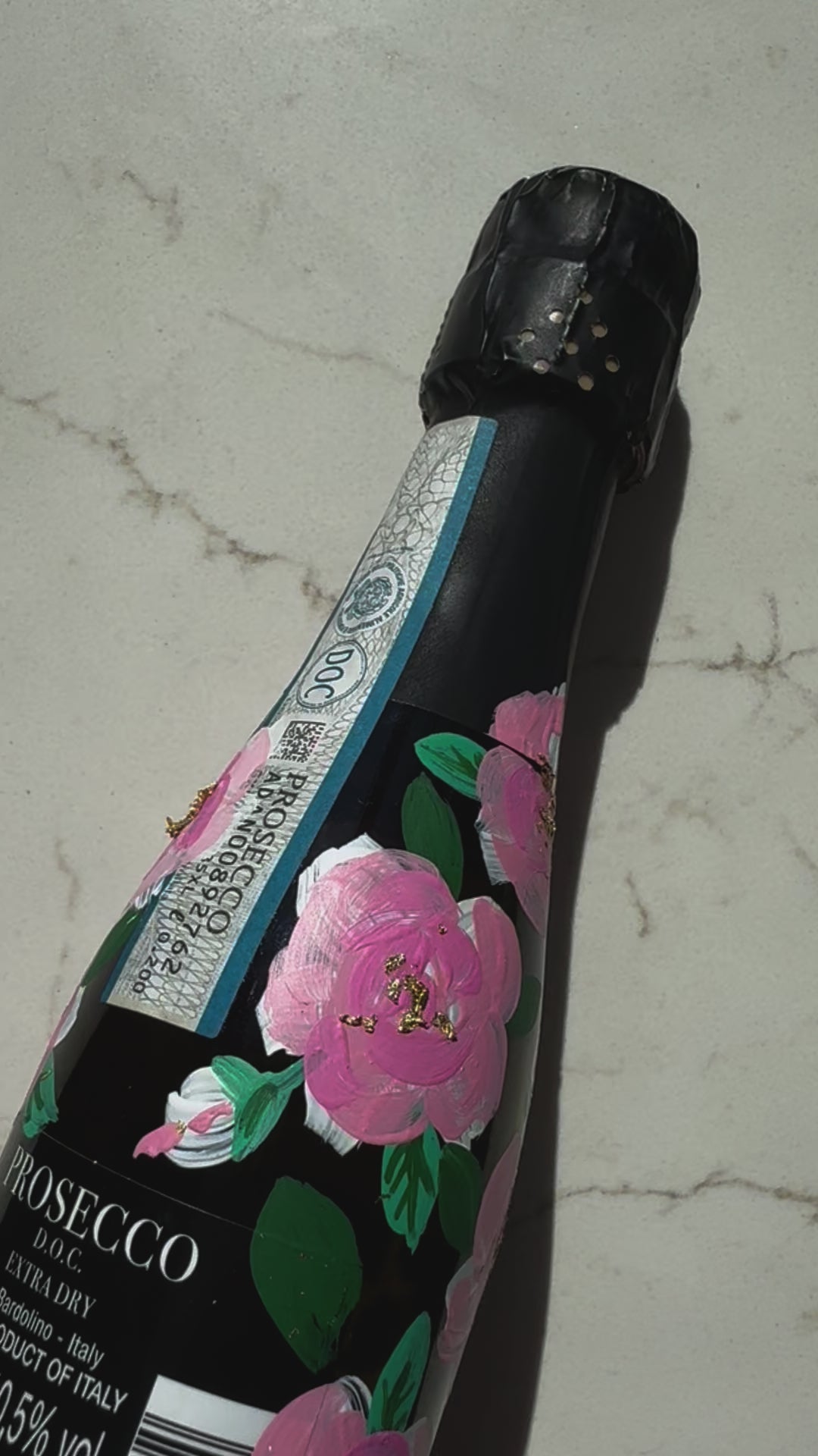 Hand painted pink roses with gold leaf accents in the centres. Painted onto mini bottles of Prosecco. a perfect bridesmaids proposal gift. Fancy Folk Design