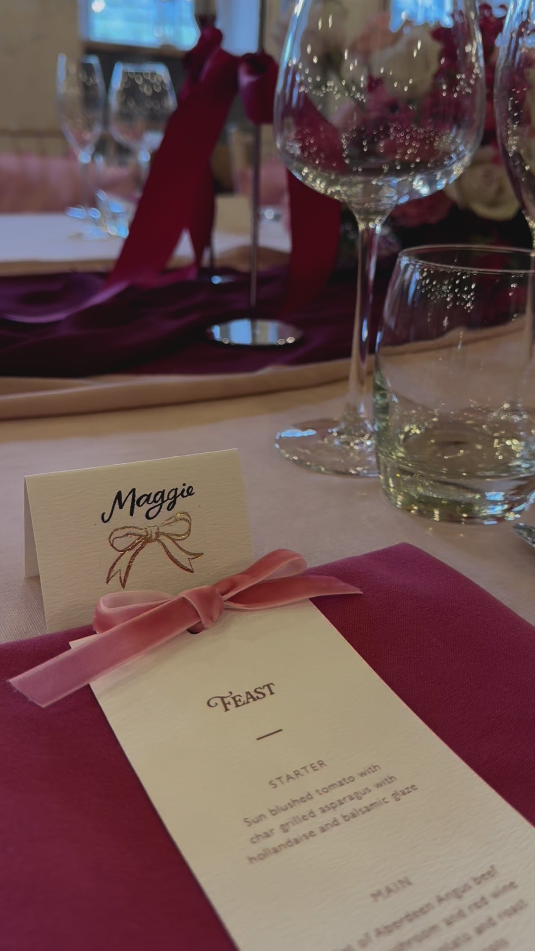 Pink and burgundy wedding table set up with ombre floral aarrangment and velvet bow menus and place cards. Designed by Fancy Folk Wedding Stationery