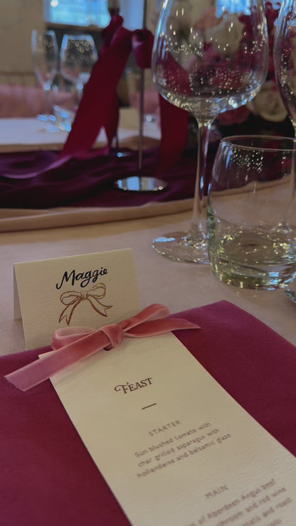 Pink and burgundy wedding table set up with ombre floral aarrangment and velvet bow menus and place cards. Designed by Fancy Folk Wedding Stationery