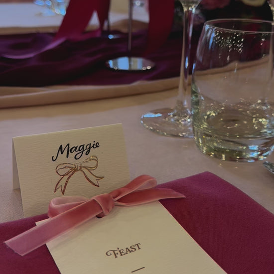 pink & burgundy velvet bow wedding breakfast menu, bow place cards and red florals, fancy folk wedding stationery