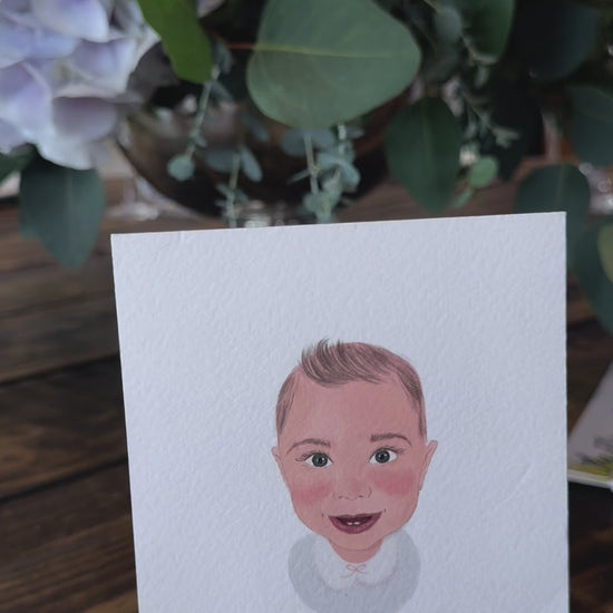 Illustrated wedding portrait of the guests used as a table place card. Surrounded by florals. Fancy Folk.