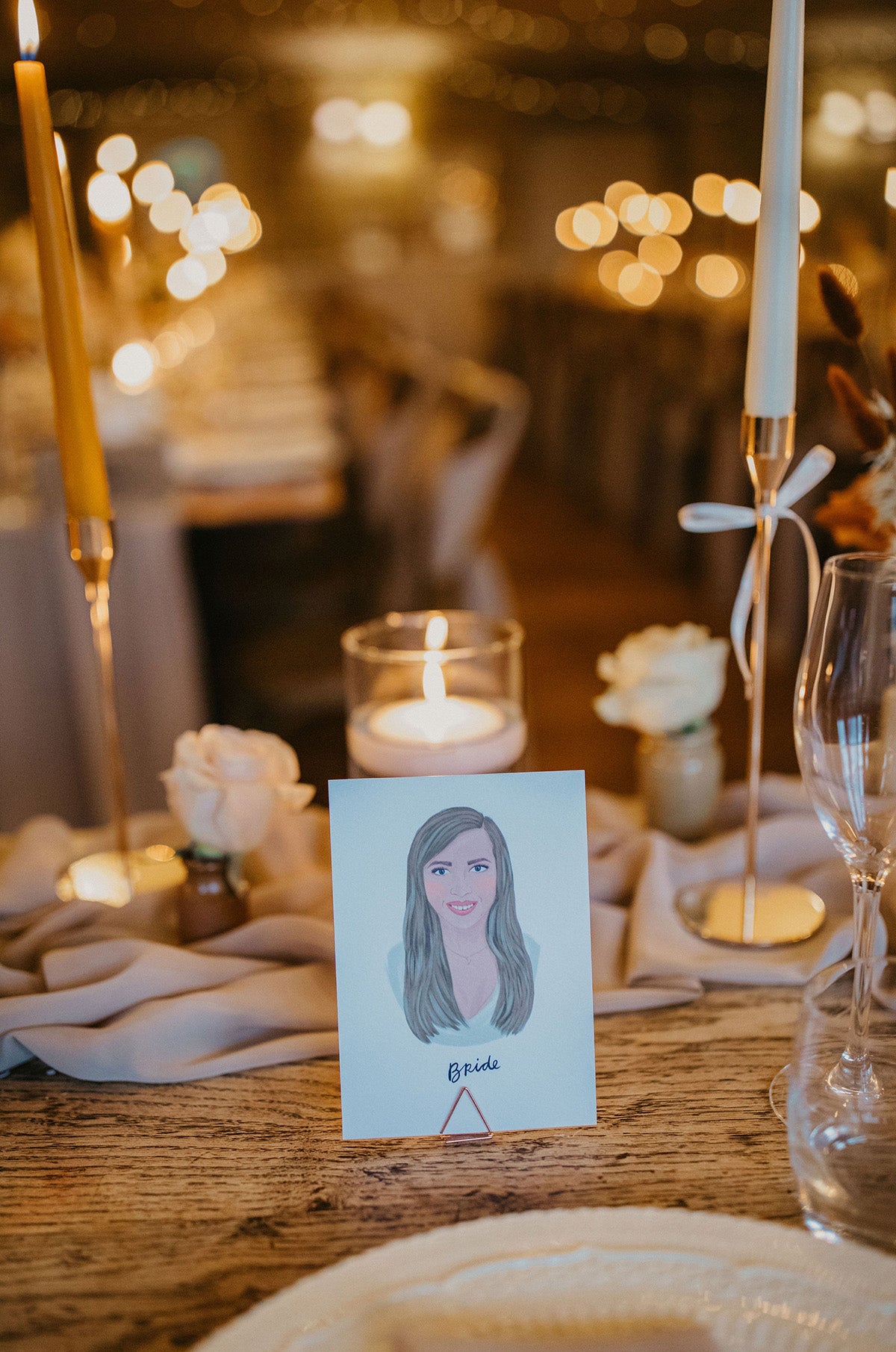 Illustrated wedding portrait of the bride used as a table place card. Surrounded by florals. Fancy Folk.